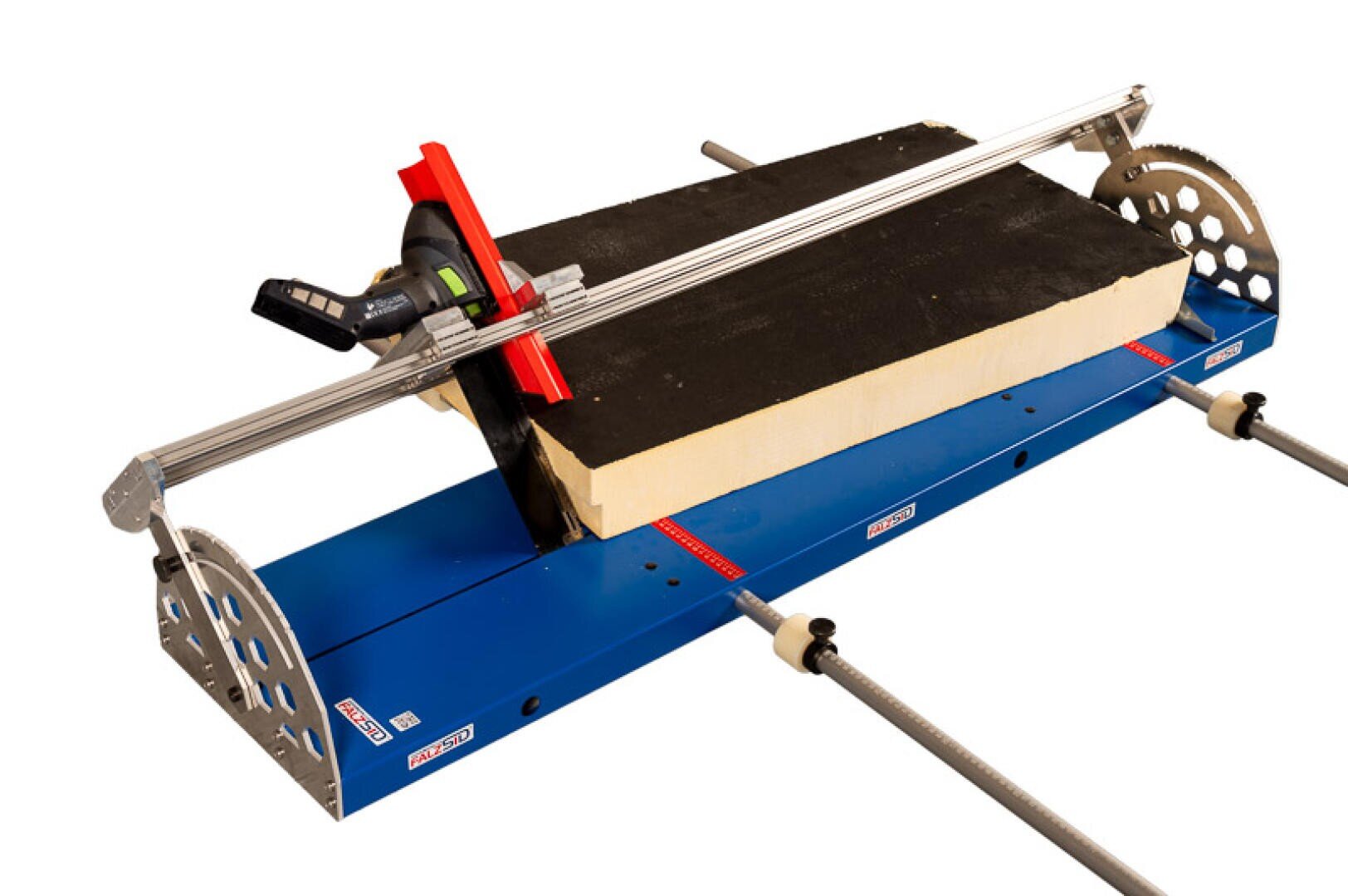 A blue panel saw with mounted cutting guide and handle, holding a rectangular block of yellow insulating material for precise cuts.