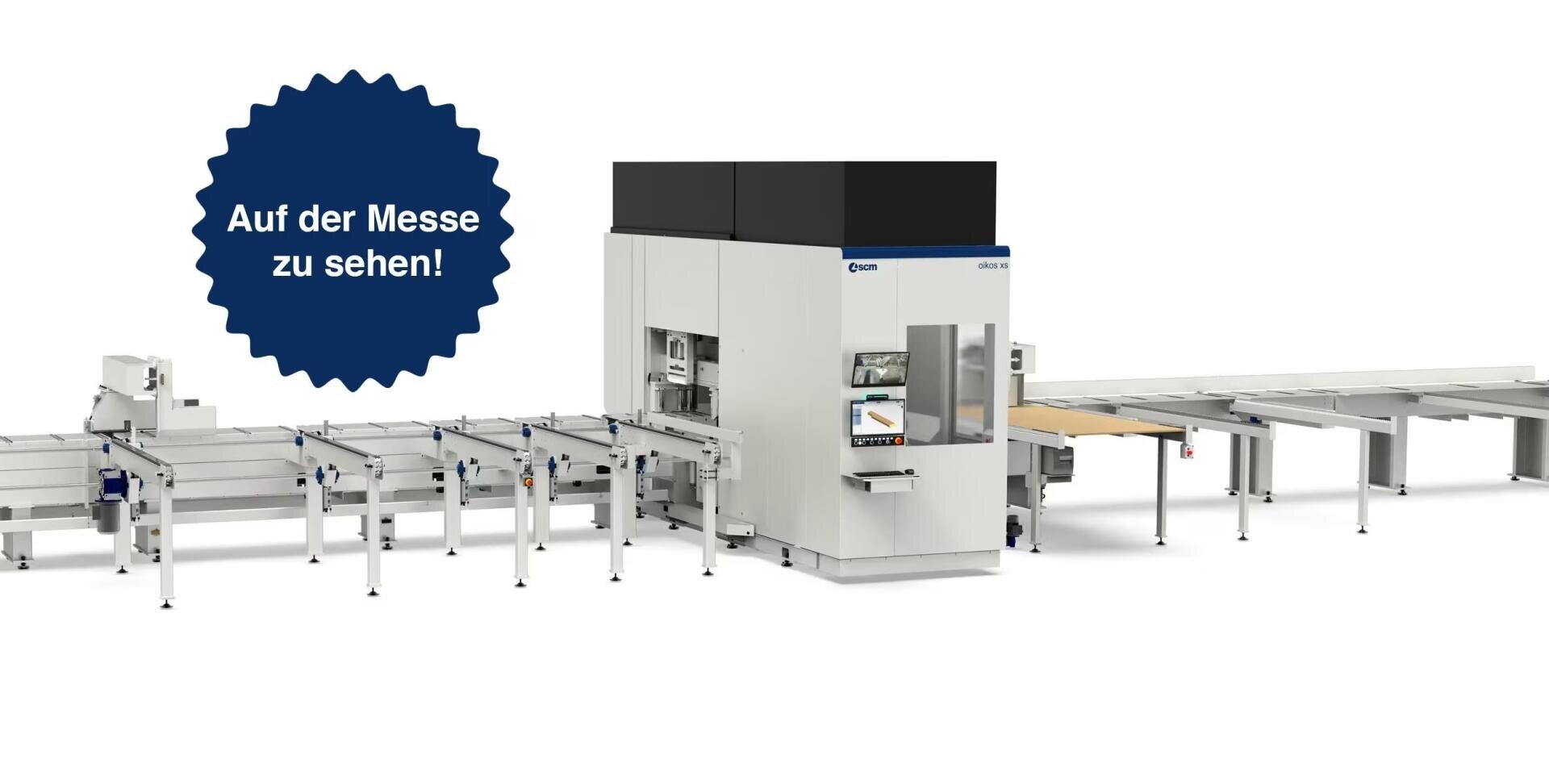 Industriemaschine mit Förderbändern, dargestellt vor einem weißen Studiohintergrund. Eine blaue Starburst-Grafik auf der linken Seite sagt "Auf der Messe zu sehen!" (Auf der Messe zu sehen!) auf Deutsch.