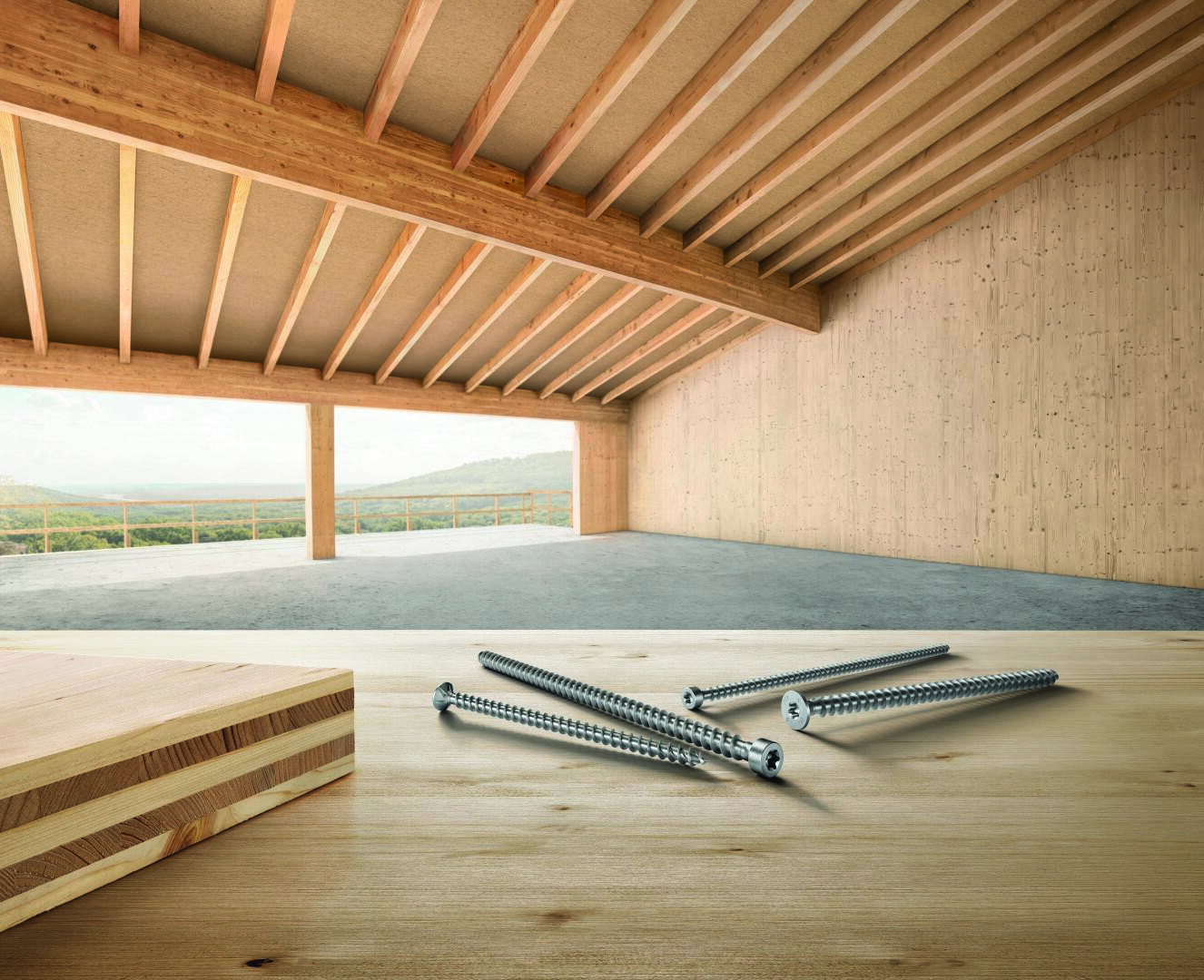 A stack of wooden planks and four metal screws lie on a wooden table in the foreground of a spacious, unfinished wooden building with exposed beams and large windows overlooking a picturesque landscape.