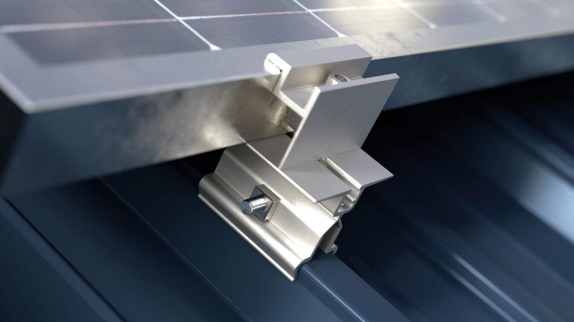 A close-up of a metal mounting bracket securely attaching a solar panel to a ribbed metal roof, focusing on the hardware and connection details.