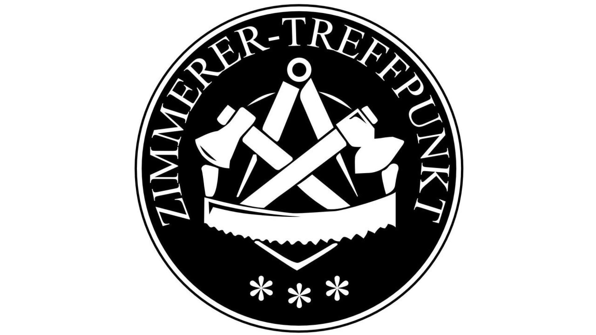 A circular black and white emblem with the words ZIMMERER-TREFFPUNKT surrounding crossed axes, a compass, and a saw in the center, with three small asterisks at the bottom.